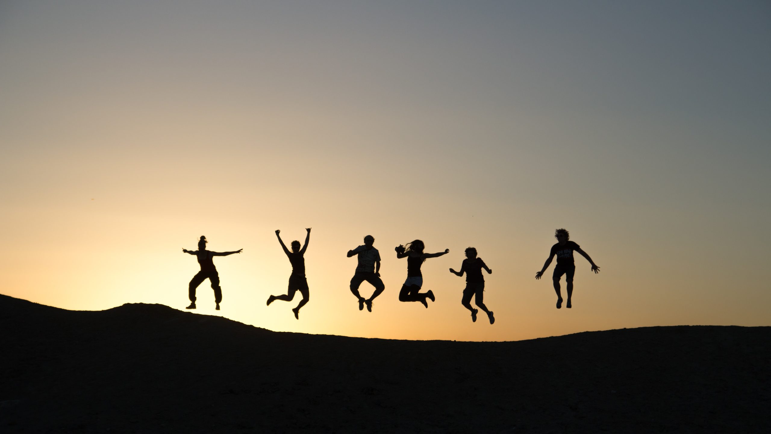 Five silhouettes jumping