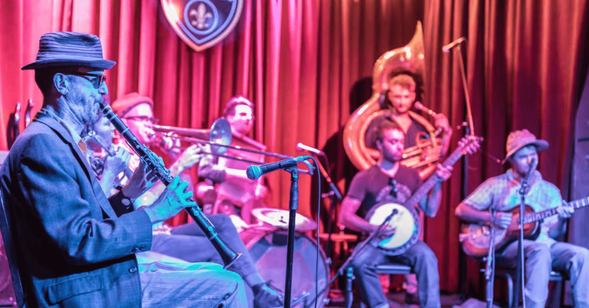 GroupSync | New Orleans for Group Travel | Jazz band playing on stage on Frenchmen Street