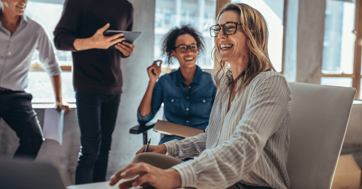 Happy co-workers working in an office