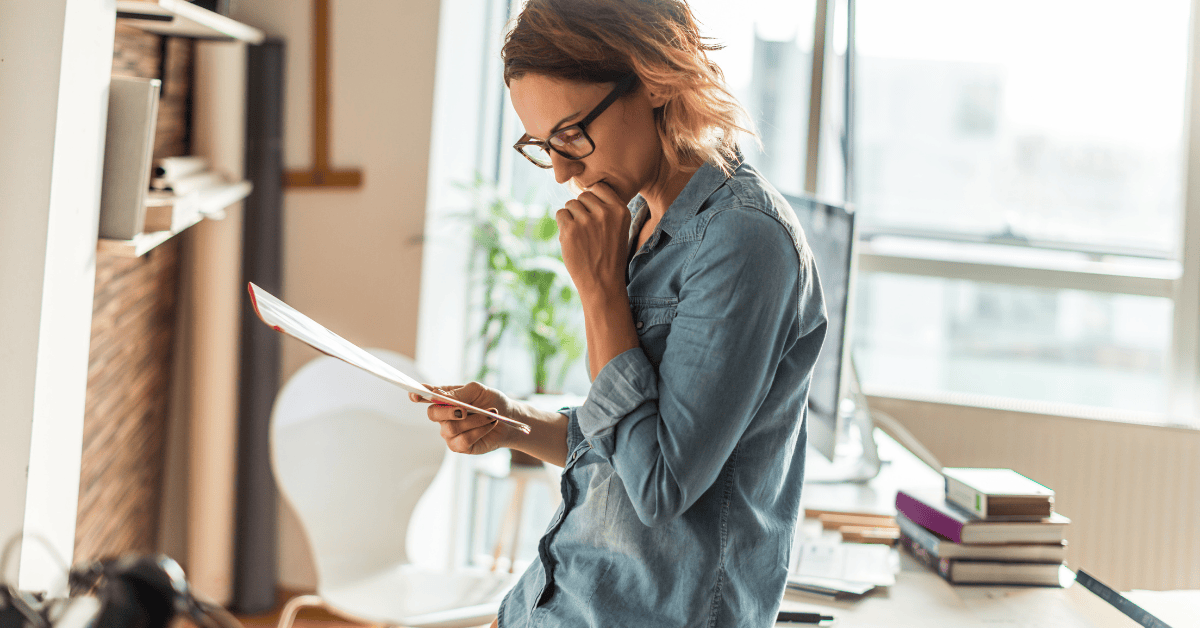 Woman reviewing a document in an office