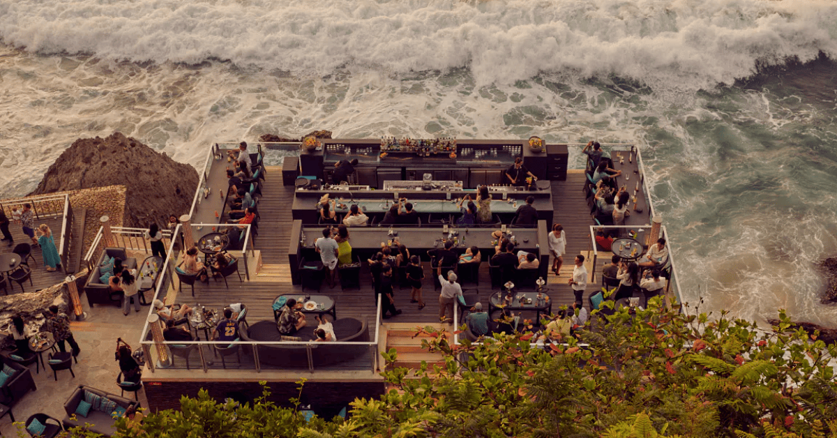 10 Famous Hotel Bars and Restaurants from Around the World feature image Rock Bar at the AYANA Resort in Bali, Indonesia overlooking the ocean with crashing waves