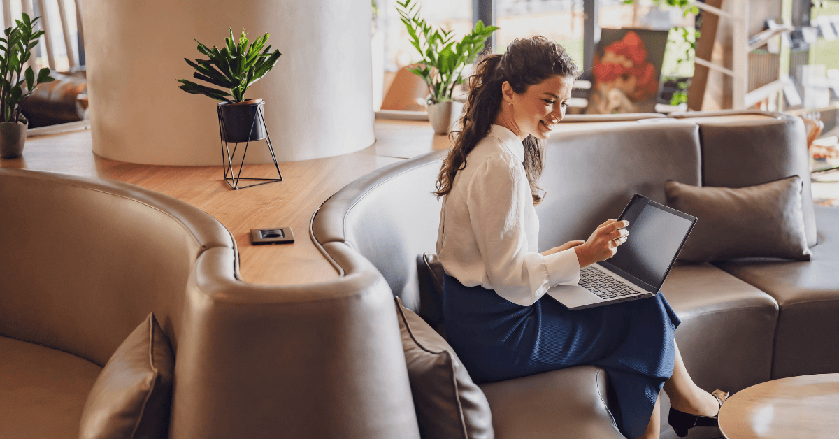 How to Compare Your Top 3 Hotel Options feature image Professional woman working on a laptop in a hotel lobby