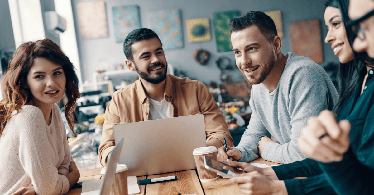 Business professionals collaborating around a desk