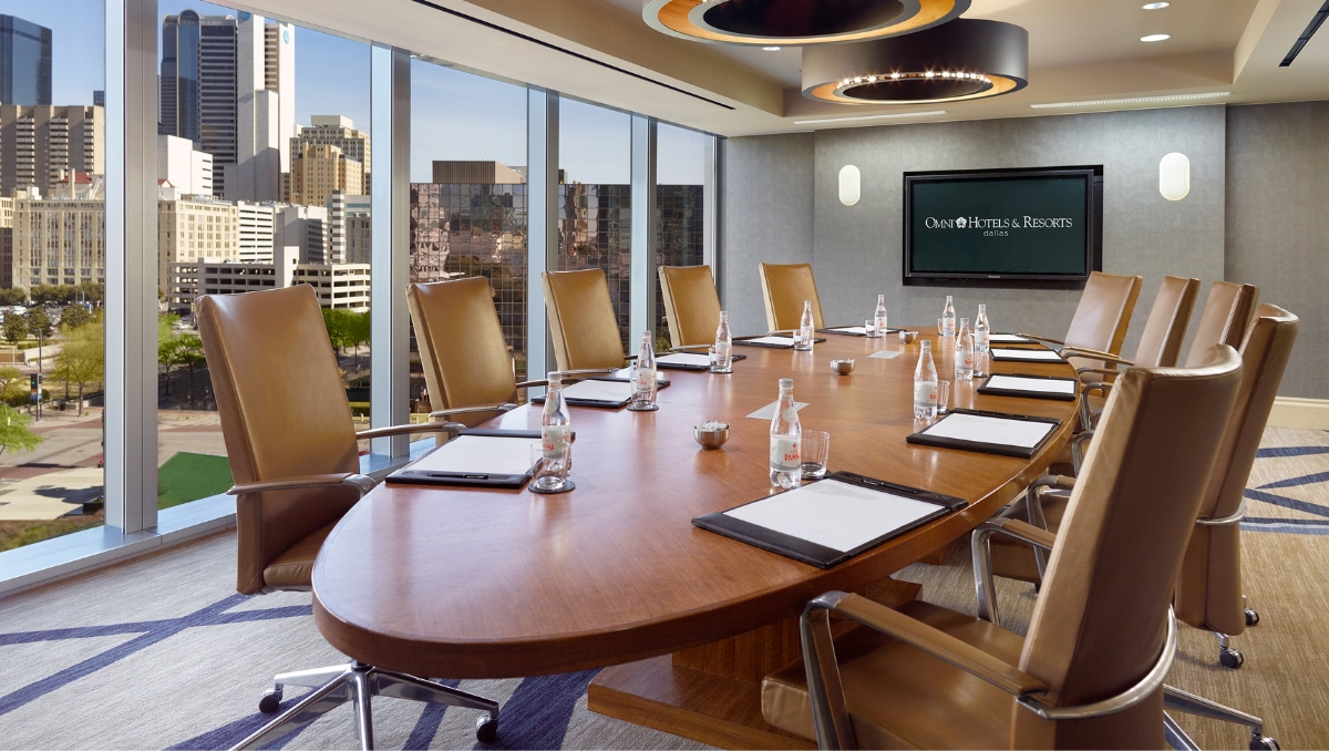 Omni Dallas Hotel board room wall to wall windows and round table seating