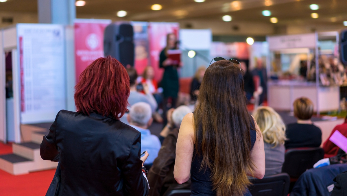 Union Cities feature image event attendees at expo booth watching speaker